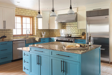 Inspiration for a large transitional l-shaped vinyl floor and beige floor open concept kitchen remodel in Milwaukee with a farmhouse sink, recessed-panel cabinets, white cabinets, quartz countertops, yellow backsplash, porcelain backsplash, stainless steel appliances, an island and multicolored countertops