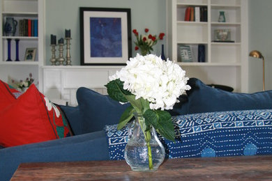 Example of a mid-sized transitional living room design in DC Metro with a wood fireplace surround and no tv