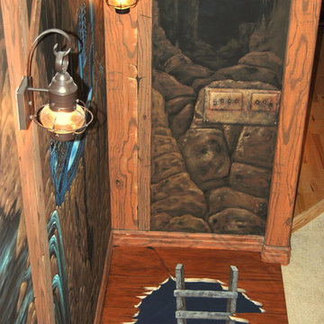The Bat Cave Themed Mural in a stairway and lower level by Tom Taylor