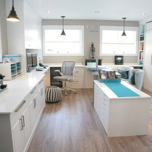 Inspiration for a large traditional study room in Montreal with grey walls, linoleum floors and a built-in desk.