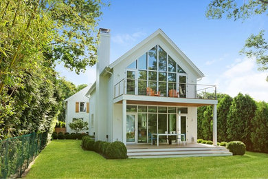 Transitional white two-story gable roof idea in New York