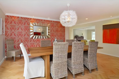 Large asian light wood floor, brown floor and wallpaper dining room photo in New York with no fireplace