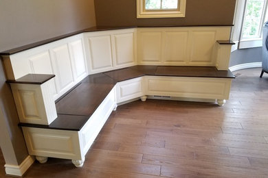Family room - mid-sized transitional open concept dark wood floor and brown floor family room idea in Detroit with brown walls, no fireplace and a wall-mounted tv
