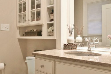 Inspiration for a mid-sized timeless beige tile and ceramic tile ceramic tile alcove shower remodel in Philadelphia with raised-panel cabinets, white cabinets, a two-piece toilet, beige walls, granite countertops and an undermount sink