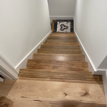 Wood Staircase with Intricate Tile Landing