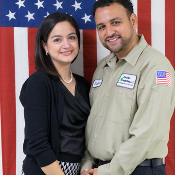Maria and Guillermo standing in front of the best flag in the world