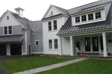 Huge elegant white two-story gable roof photo in Boston