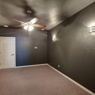 Inspiration for a medium sized traditional enclosed home cinema in Oklahoma City with grey walls, carpet, a wall mounted tv and grey floors.