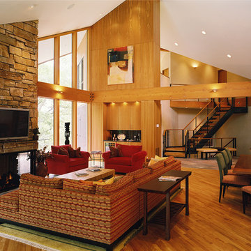 Vaulted Living Room with stone fireplace and beams