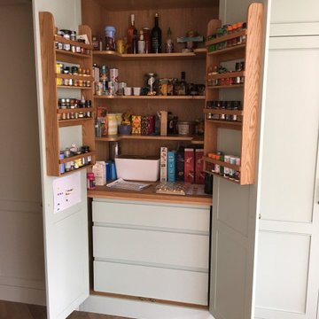 Dulwich Kitchen bespoke larder with solid oak spice racks, shelving and work top