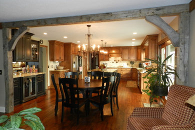Photo of a mid-sized traditional open plan dining in Cleveland with beige walls, medium hardwood floors and no fireplace.