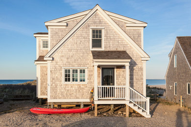 Example of a beach style home design design in Boston