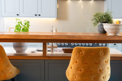 This is an example of a contemporary home bar in Hertfordshire.