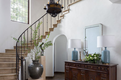 Mid-sized tuscan staircase photo in Los Angeles