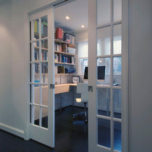 Design ideas for a modern study in DC Metro with white walls and a built-in desk.