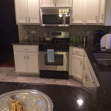 This is oak cabinets after we refinish dover white color