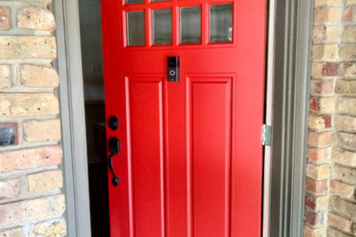 Small 1960s entryway photo in Dallas with a red front door