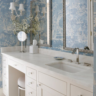 Elegant white floor bathroom photo in Nashville with shaker cabinets, white cabinets, blue walls and an undermount sink