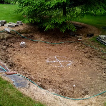 Donna Reed or My Three Sons? "Hidden" patio & rustic retainer wall w/fire pit