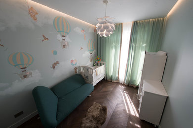 Medium sized playroom in Saint Petersburg with medium hardwood flooring.