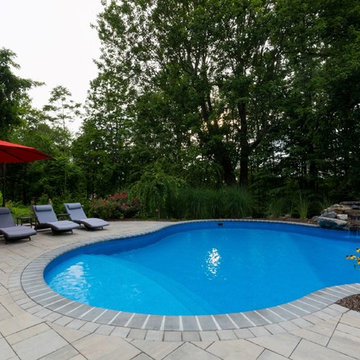Vinyl pool with Waterfall, Landscape Lighting and Landscaping