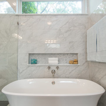 Bathroom | Elegant Custom Cabinets | Marble Tile & Freestanding Tub