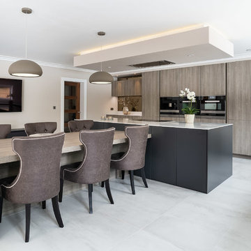 Contemporary Kitchen with a T Shape Island and Dining