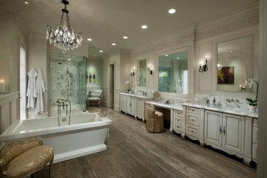 Bathroom - huge traditional bathroom idea in Phoenix with an undermount sink, raised-panel cabinets, beige cabinets and beige walls