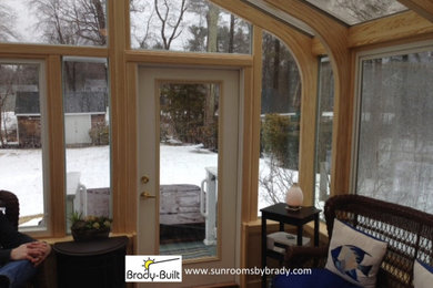 Example of a transitional sunroom design in Boston