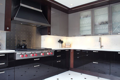 Kitchen - large contemporary l-shaped porcelain tile and white floor kitchen idea in Other with an undermount sink, flat-panel cabinets, black cabinets, quartzite countertops, white backsplash, marble backsplash, stainless steel appliances and white countertops