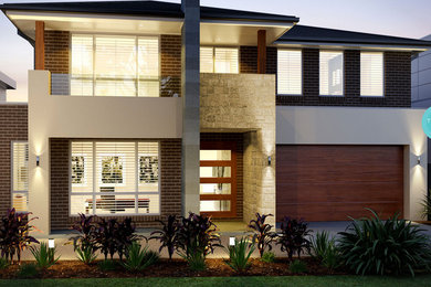 Inspiration for a contemporary two-storey exterior in Sydney.
