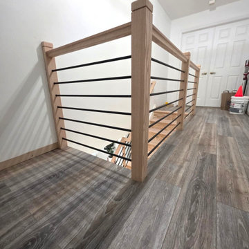 Horizontal Stair Railing with Red Oak T-Rail and Black Metal Bars