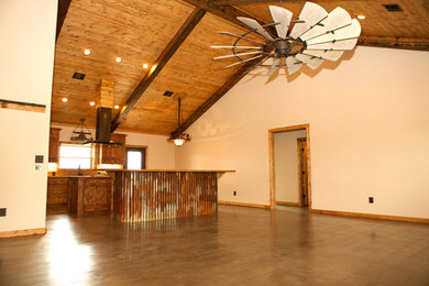 Example of a large mountain style l-shaped dark wood floor and brown floor kitchen design in Houston with a drop-in sink, flat-panel cabinets, medium tone wood cabinets, wood countertops, stainless steel appliances, two islands and brown countertops