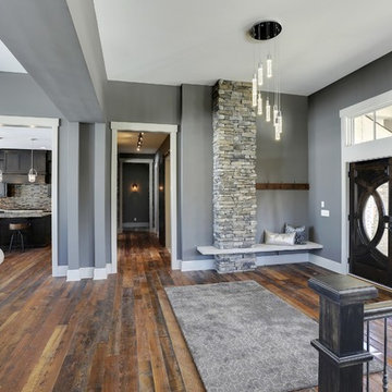 Weathered Antique Flooring in an Open Entry and Living Space