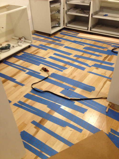 gluing down prefinished SOLID hardwood floors directly over a concrete
