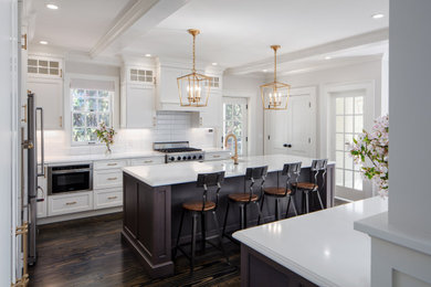 Inspiration for a contemporary brown floor kitchen remodel in Providence with marble countertops, white backsplash, subway tile backsplash and white countertops