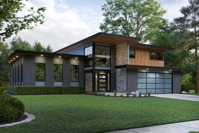 This is an example of a large modern two-storey grey duplex exterior in Other with mixed siding and a flat roof.