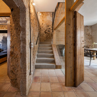 Design ideas for a medium sized mediterranean concrete curved staircase in Barcelona with concrete risers.