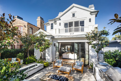Inspiration for a mid-sized contemporary backyard concrete paver patio remodel in Los Angeles with a fire pit and no cover