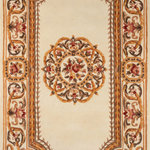 Momeni - Momeni Harmony India Hand Tufted Transitional Area Rug Ivory 8' X 11' - The antique-style embellishment of this traditional area rug adds ornamental flourish to floors throughout the home. Available in royal shades of sage green, soft blue, ivory, rose and regal burgundy red, the ornate gold scrolls and scallops of each decorative floorcovering reflect the gilded grandeur of French baroque style. Hand tufted from 100% natural wool fibers, the curling vines and lush floral bouquets of the borders are hand carved for exquisite depth and dimension.