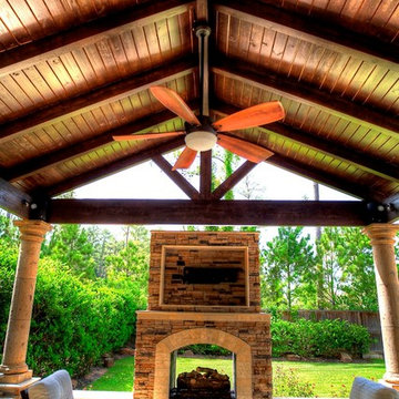 Grand home addition with outdoor kitchen see through fireplace - km