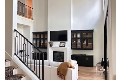 Trendy open concept light wood floor and tray ceiling living room photo in Salt Lake City with yellow walls, a standard fireplace, a concrete fireplace and a wall-mounted tv