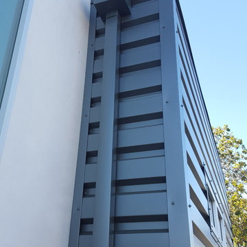 24 Gauge Steel, Collector Box and Downspout on Matching Wall Panels.