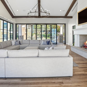Open Folding Glass Wall Links the Fireside Living Room to the Deck and Pool