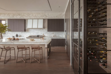 Foto de cocina contemporánea con encimera de mármol, salpicadero de mármol, electrodomésticos de acero inoxidable y suelo de madera en tonos medios