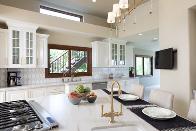 Example of a large single-wall white floor kitchen design in Los Angeles with white cabinets, white backsplash, an island and white countertops