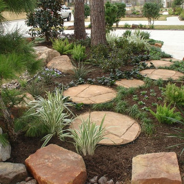 Landscaping with oversize pavers and backyard creek - hkns