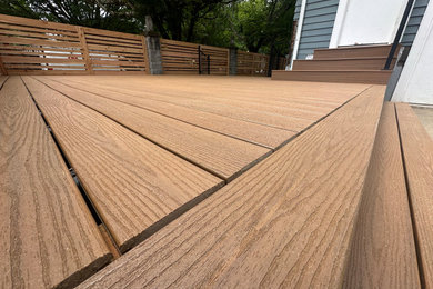 Inspiration for a mid-sized backyard metal railing deck remodel in Portland