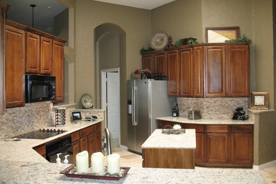 Large transitional u-shaped open concept kitchen photo in Dallas with shaker cabinets, medium tone wood cabinets, granite countertops, beige backsplash, mosaic tile backsplash, stainless steel appliances and an island