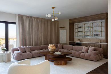 Minimalist dark wood floor and brown floor living room photo in Las Vegas with beige walls
